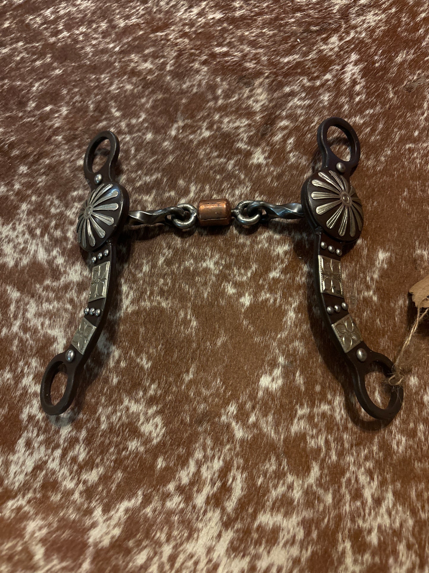 Brown steel concho style bit with copper roller dogbone mouth